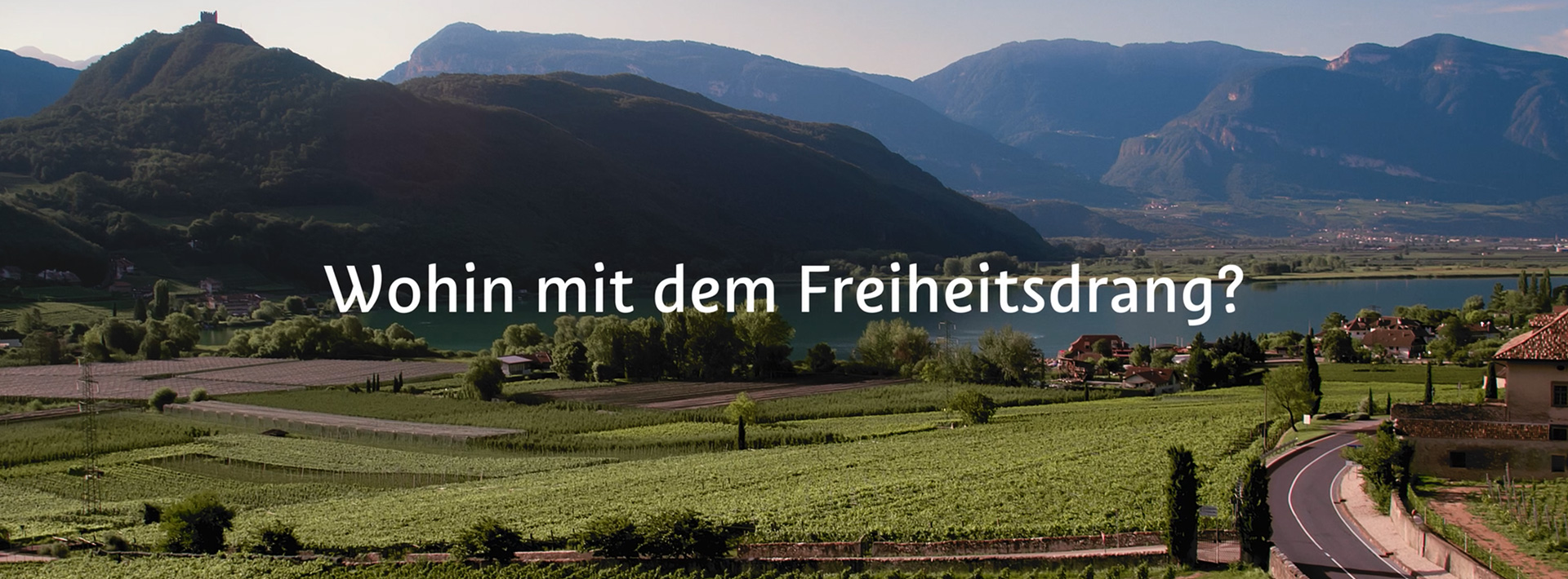 Landscape of a lake and mountains with german capture"Wohin mit dem Freiheitsdrang?"